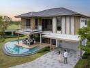 Modern two-story house with pool and garden