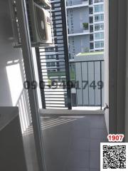 Compact balcony with air conditioning unit in an apartment building