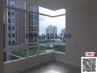 Spacious bedroom with large windows and city view