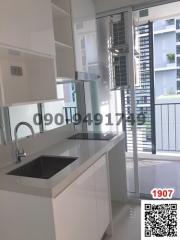 Modern kitchen with white cabinetry and natural light