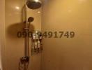 Modern bathroom shower with stainless steel fixtures