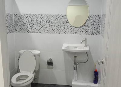 Modern bathroom with a toilet and sink