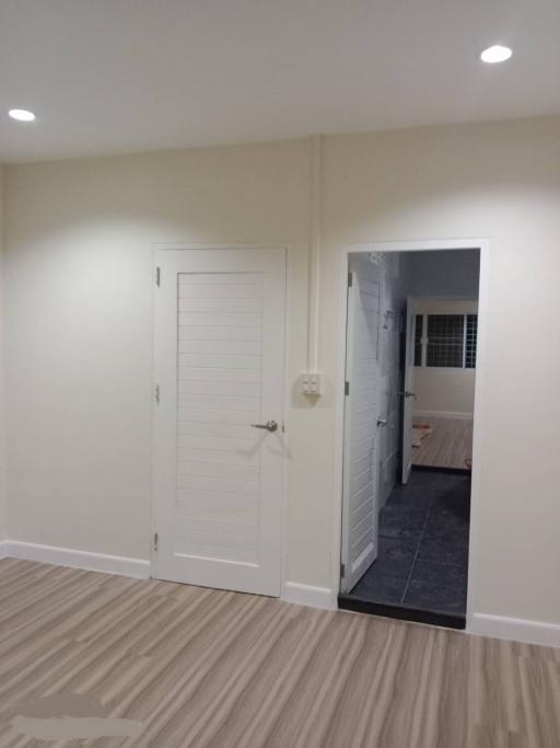 Cozy renovated bedroom with neutral tones and new carpet