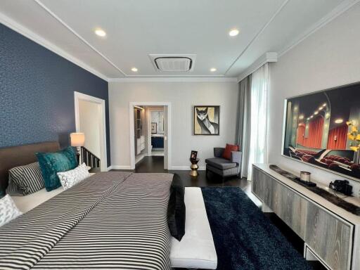 Spacious and well-decorated bedroom with modern amenities