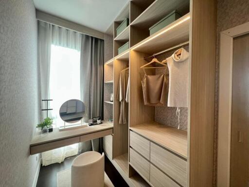 Cozy bedroom interior with built-in wardrobe and vanity