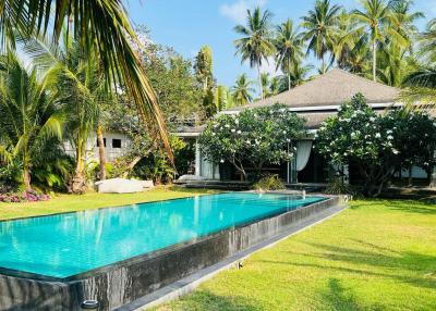 Balinese style beach front villa for sale in Bang Kao