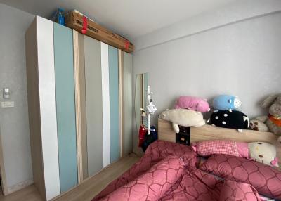 Cozy bedroom interior with wardrobe and plush toys