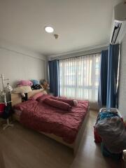 Cozy bedroom with natural light and air conditioning unit