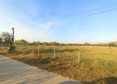 Spacious open land ready for development under a clear blue sky