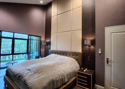 Contemporary bedroom with queen-sized bed and modern decor