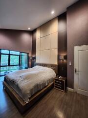 Contemporary bedroom with queen-sized bed and modern decor