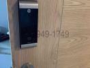 Modern electronic lock system on wooden door
