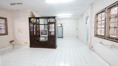 Spacious unfurnished living room with tiled flooring and multiple windows