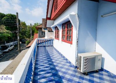 Bright and airy balcony with blue and white color scheme