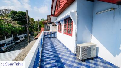 Bright and airy balcony with blue and white color scheme