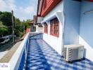 Bright and airy balcony with blue and white color scheme