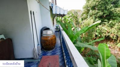 Balcony area with a view of greenery