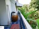 Balcony area with a view of greenery