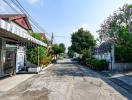 Residential street view with surrounding homes and paved road