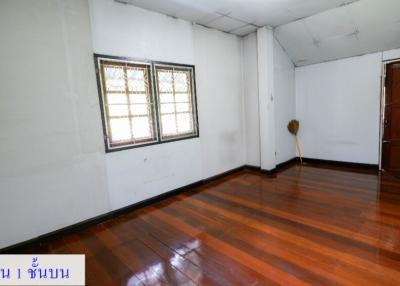 Spacious unfurnished living room with hardwood floors and ample natural light