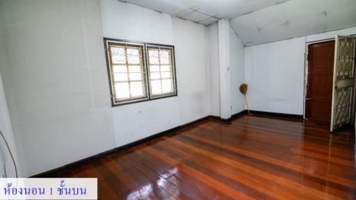 Spacious unfurnished living room with hardwood floors and ample natural light