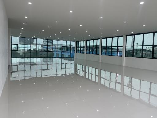 Spacious and modern open-plan commercial space with large windows and ample natural light