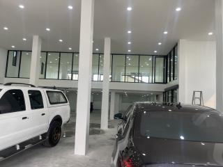 Spacious indoor parking area of a modern building with bright lighting