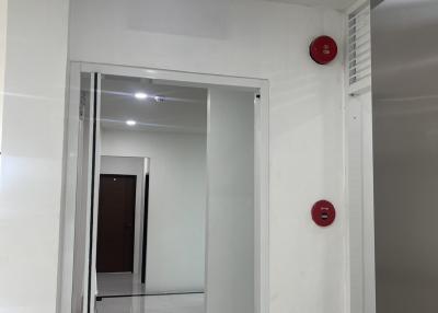 Corridor area with fire exit sign and safety equipment