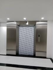 Modern elevator in a residential building lobby