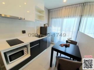 Modern kitchen with dining area and natural lighting