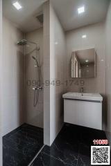 Modern tiled bathroom with shower and sink