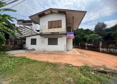 Two-story house with large front yard for sale