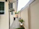 Side yard with air conditioning unit and small garden space