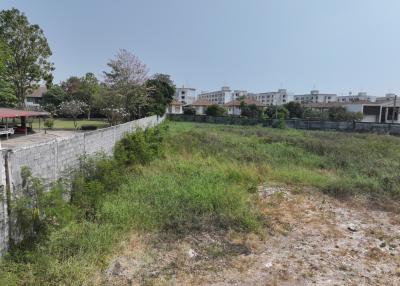 Vast open land with potential for development near residential buildings