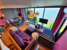 Spacious living room with floor-to-ceiling windows offering ocean views