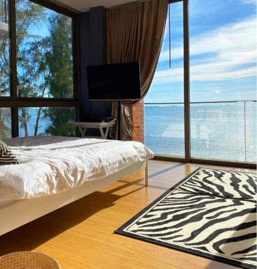 Ocean view bedroom with floor-to-ceiling windows