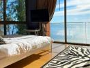 Ocean view bedroom with floor-to-ceiling windows