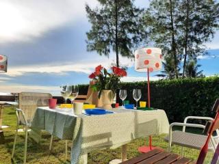 Outdoor dining area with ocean view and setting for a meal