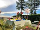 Outdoor dining area with ocean view and setting for a meal