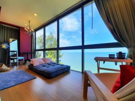 Spacious living room with large windows and ocean view