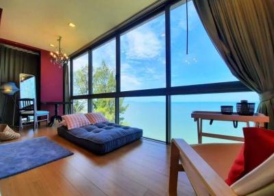 Spacious living room with large windows and ocean view
