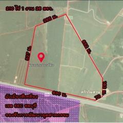 Aerial view of a land plot with boundary markings and measurements