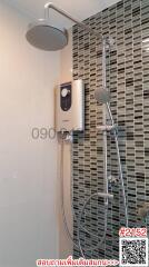 Modern shower with adjustable showerhead and stylish mosaic wall tiles