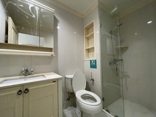 Modern bathroom with glass shower and white interior