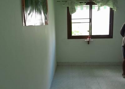Bright empty room with tiled flooring and a window