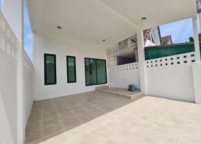 Spacious outdoor patio area with tile flooring and ample natural light