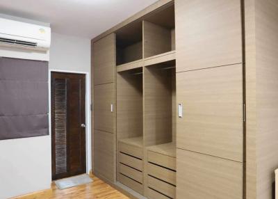 Spacious bedroom with built-in wardrobe and air conditioning