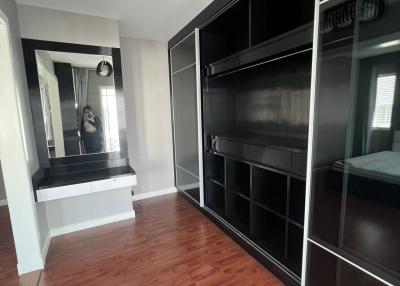 Spacious bedroom with built-in wardrobe and modern ceiling fan