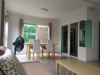 Bright and airy living room with dining area and access to the balcony