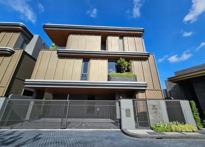 Modern residential building exterior with clear blue sky